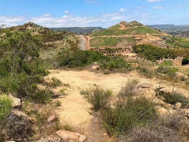 a view of a city with mountains in the background