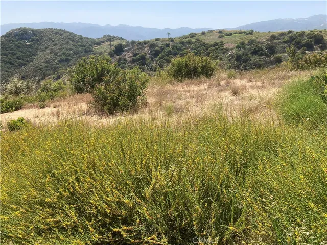 a view of a lake with mountains in the background