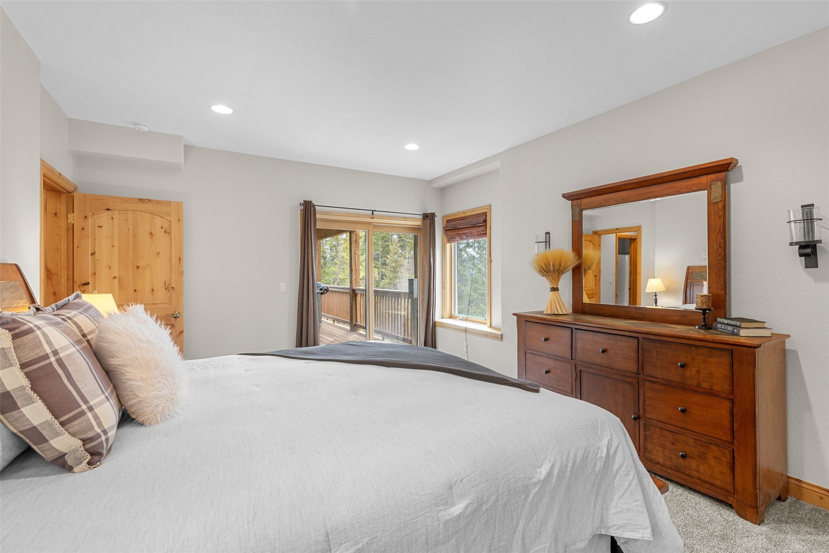 91795 Ryan Gulch Road Silverthorne, CO 80498 - Photo 46 of 50 a bedroom with a bed and a dresser