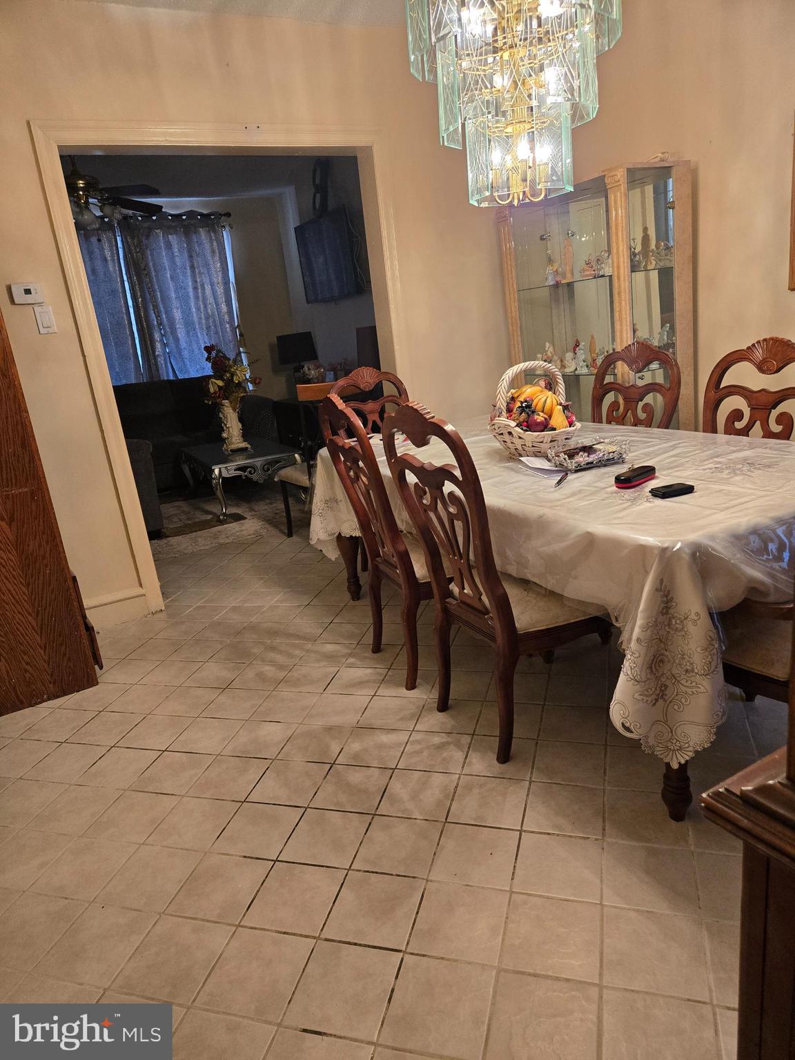 5112 North Fairhill Street Philadelphia, PA 19120 - Photo 14 of 20 a bedroom with furniture and a chandelier