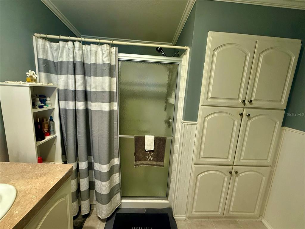 3530 Rossmere Road Port Charlotte, FL 33953 - Photo 12 of 32 a bathroom with a granite countertop shower and a sink