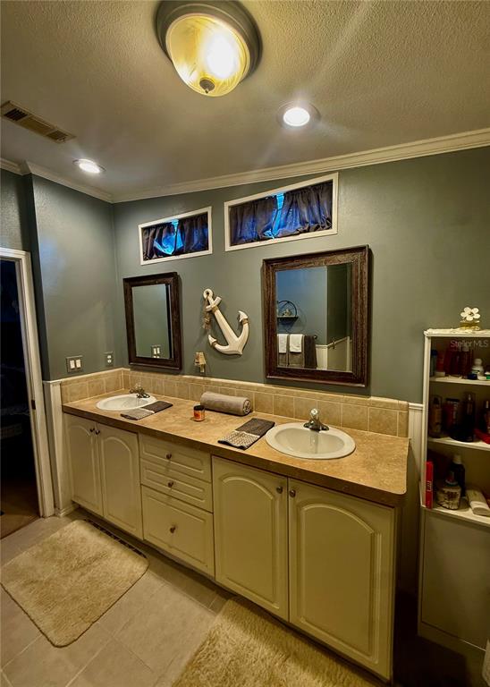 3530 Rossmere Road Port Charlotte, FL 33953 - Photo 13 of 32 a bathroom with a granite countertop sink and a mirror
