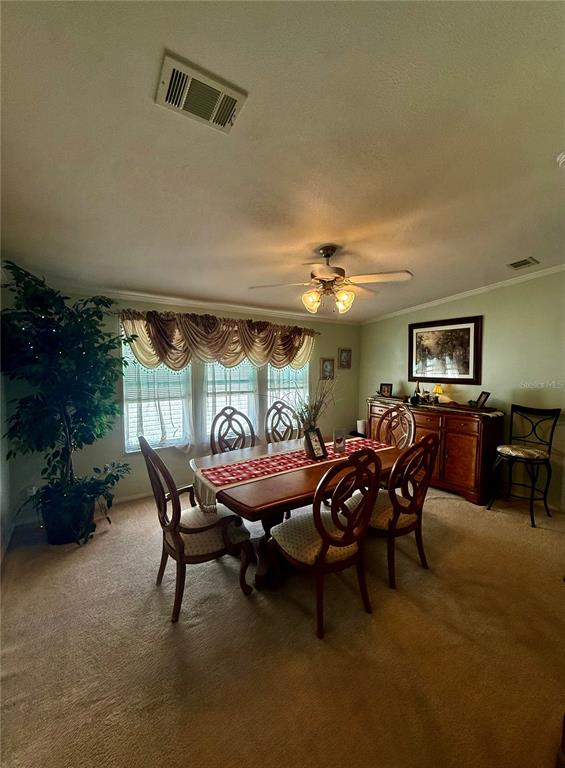 3530 Rossmere Road Port Charlotte, FL 33953 - Photo 19 of 32 a view of a dining room with furniture window and outside view