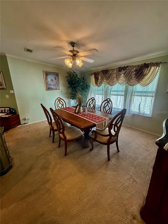 3530 Rossmere Road Port Charlotte, FL 33953 - Photo 20 of 32 a dining room with furniture and window