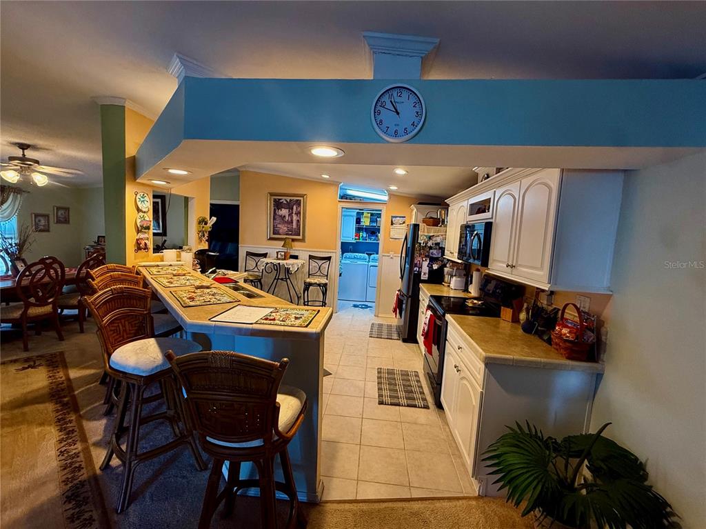 3530 Rossmere Road Port Charlotte, FL 33953 - Photo 23 of 32 a view of a dining room with furniture
