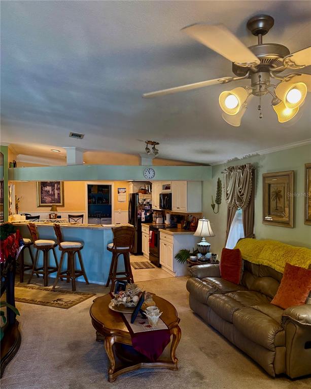 3530 Rossmere Road Port Charlotte, FL 33953 - Photo 26 of 32 a living room with furniture a dining table and chairs with wooden floor