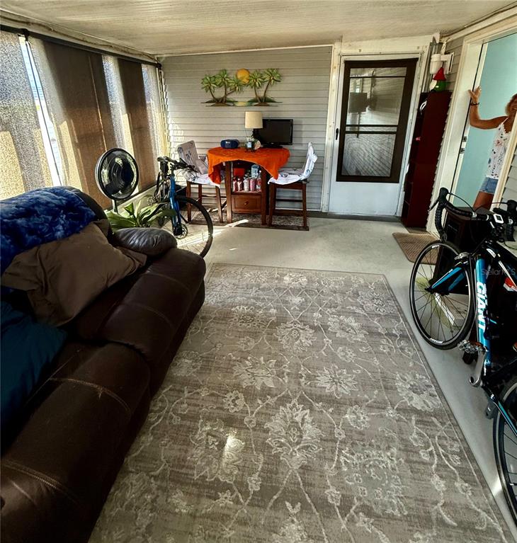 3530 Rossmere Road Port Charlotte, FL 33953 - Photo 30 of 32 a living room with furniture and a window