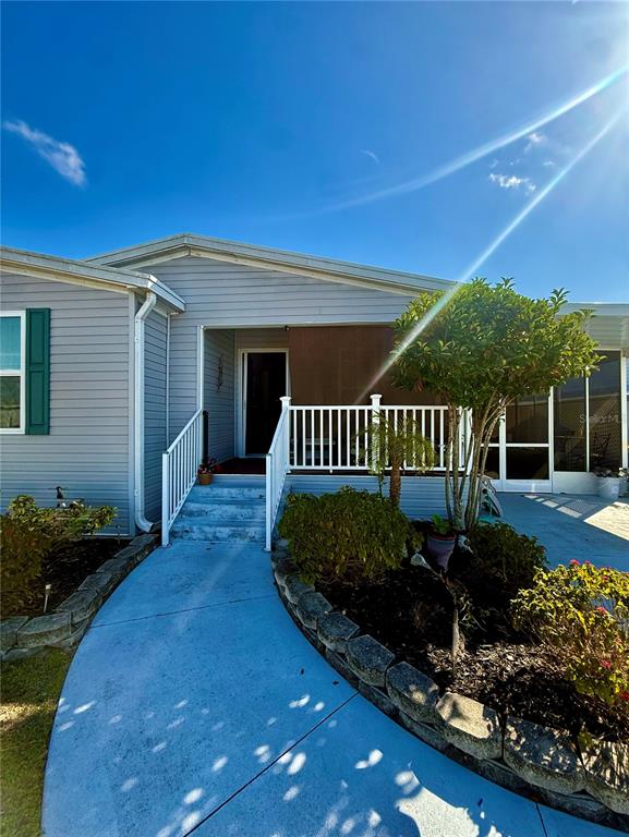 3530 Rossmere Road Port Charlotte, FL 33953 - Photo 4 of 32 a view of a chair and table in backyard