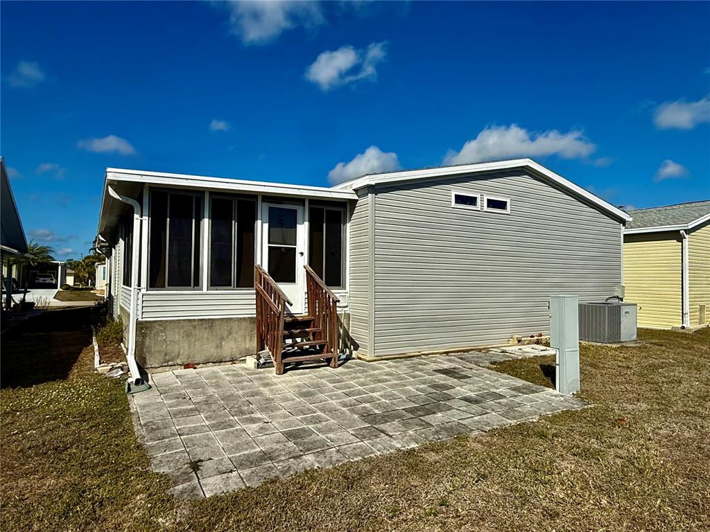 3530 Rossmere Road Port Charlotte, FL 33953 - Photo 6 of 32 a view of a small house with backyard
