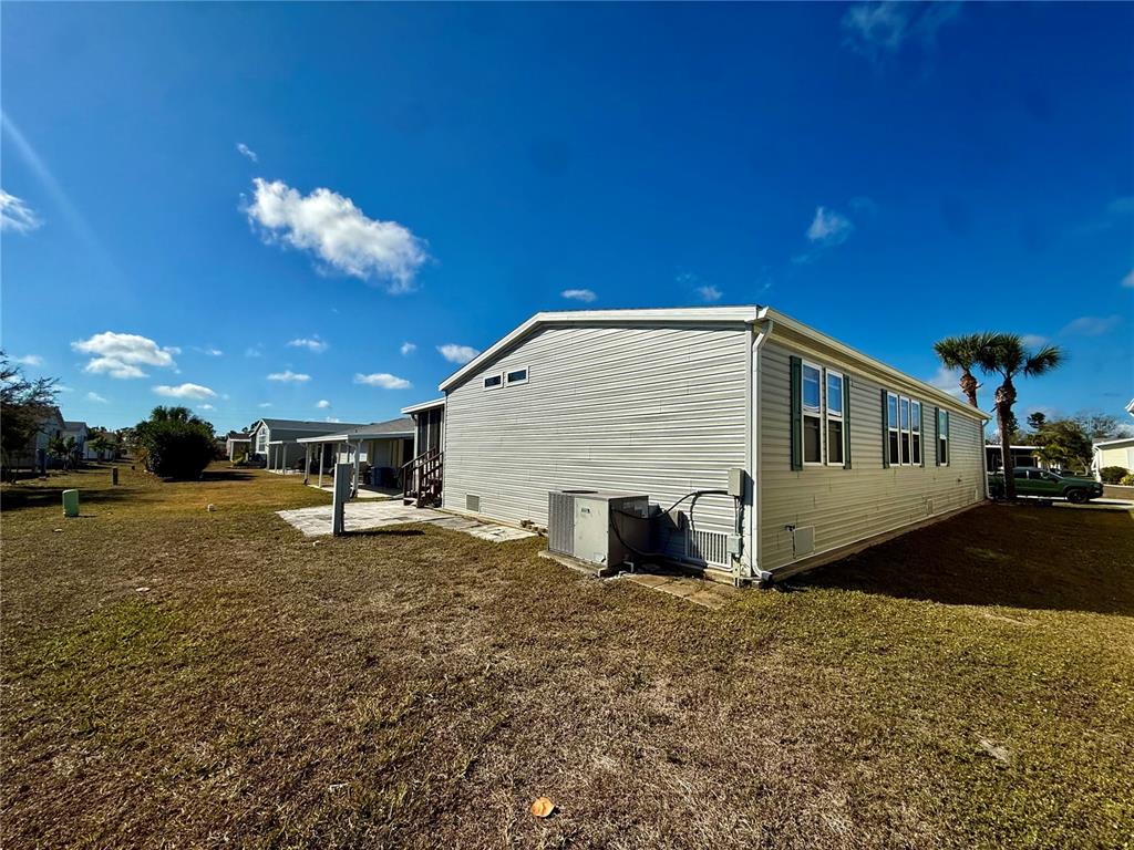 3530 Rossmere Road Port Charlotte, FL 33953 - Photo 7 of 32 a view of a house with a yard