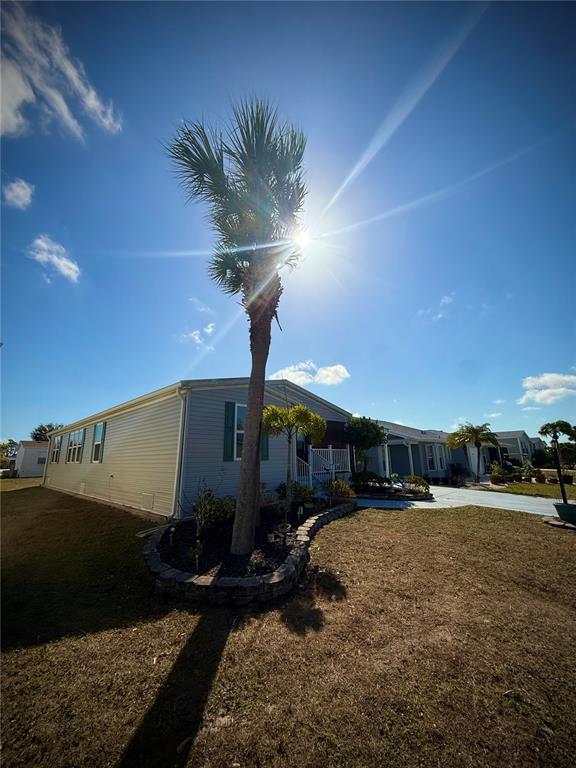 3530 Rossmere Road Port Charlotte, FL 33953 - Photo 8 of 32 a outdoor space with lots of palm trees