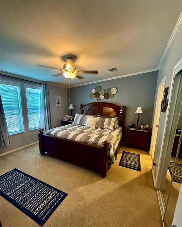 3530 Rossmere Road Port Charlotte, FL 33953 - Photo 9 of 32 a bedroom with a bed and window