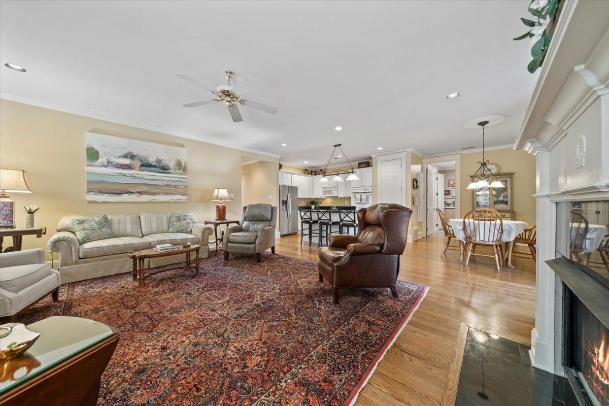 1436 Wolf Park Road Germantown, TN 38138 - Photo 18 of 34 a living room with furniture kitchen view and a chandelier
