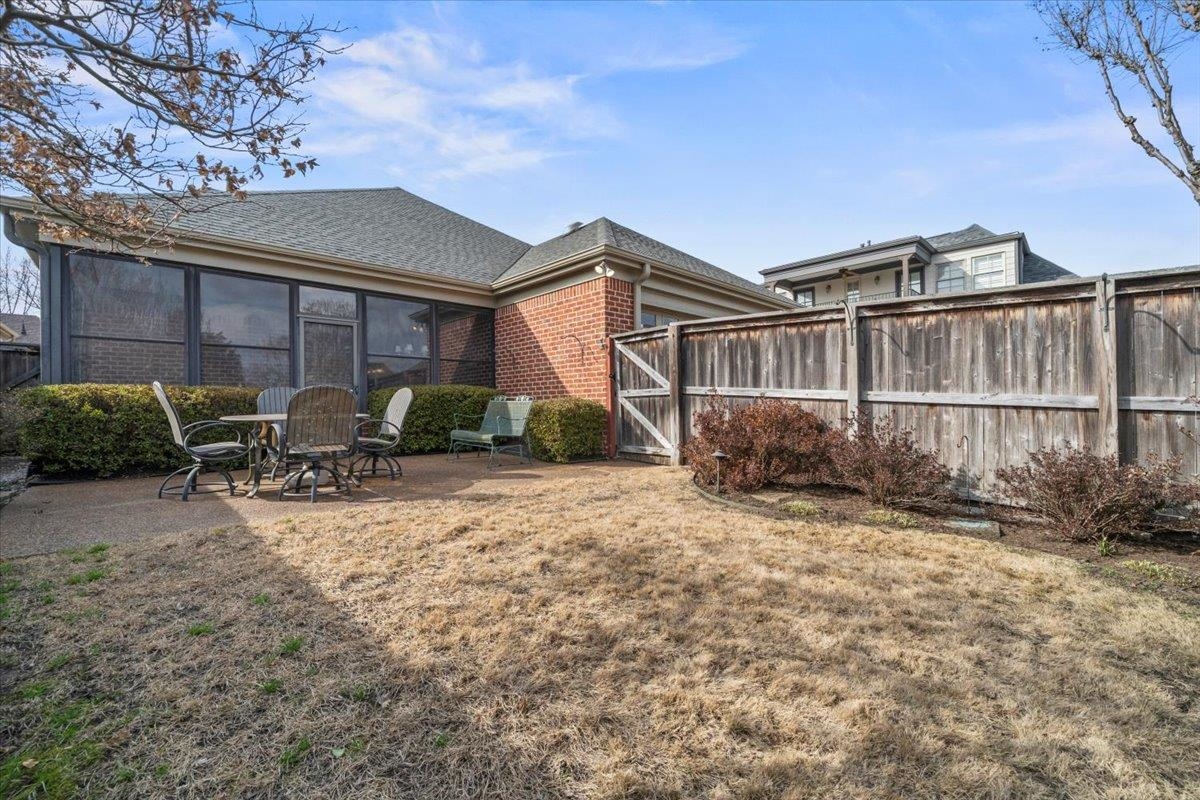 1436 Wolf Park Road Germantown, TN 38138 - Photo 31 of 34 a backyard of a house with table and chairs