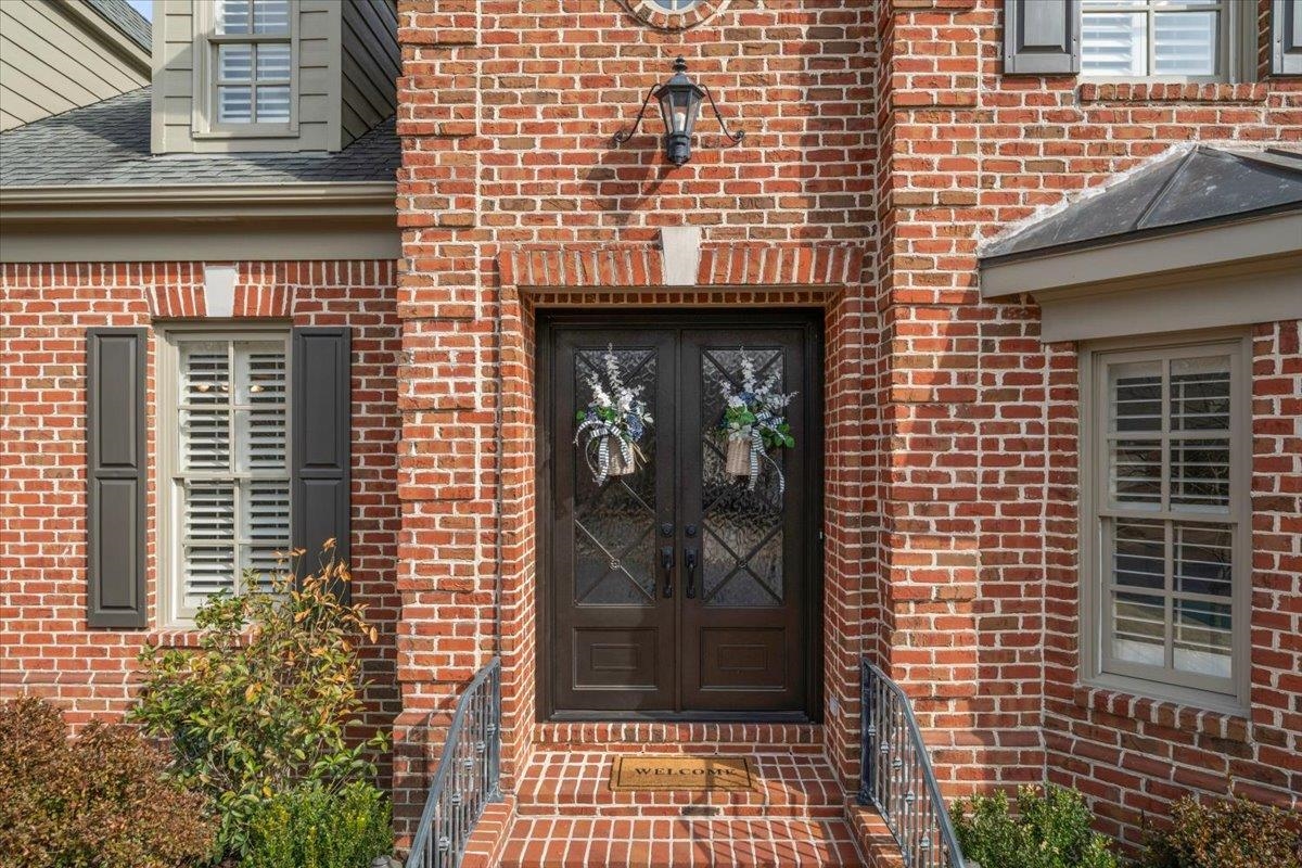 1436 Wolf Park Road Germantown, TN 38138 - Photo 5 of 34 a view of a brick house with a door