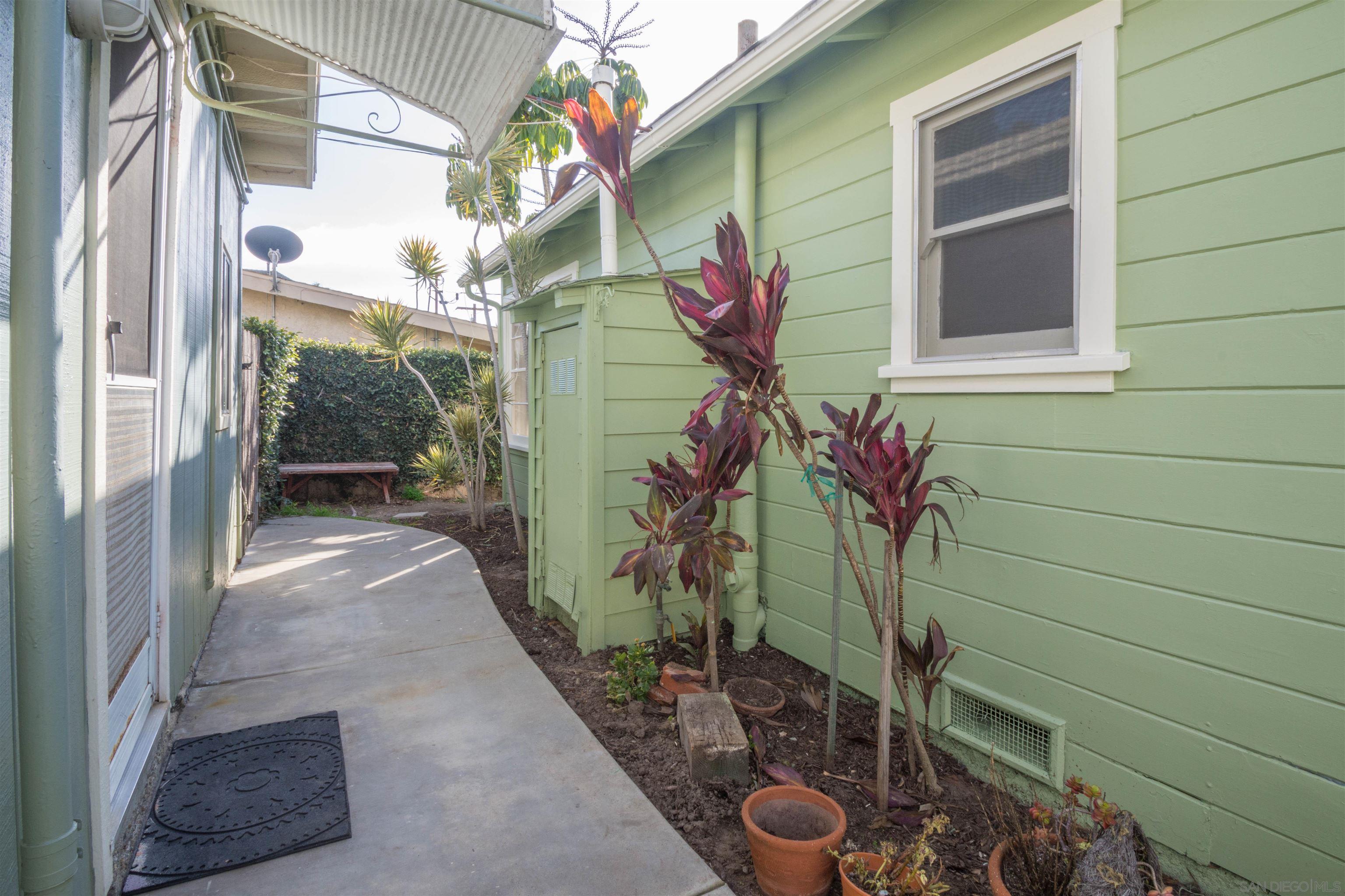3218 Eureka Place, Unit B Carlsbad, CA 92008 - Photo 2 of 18 a flower plants in front of a door