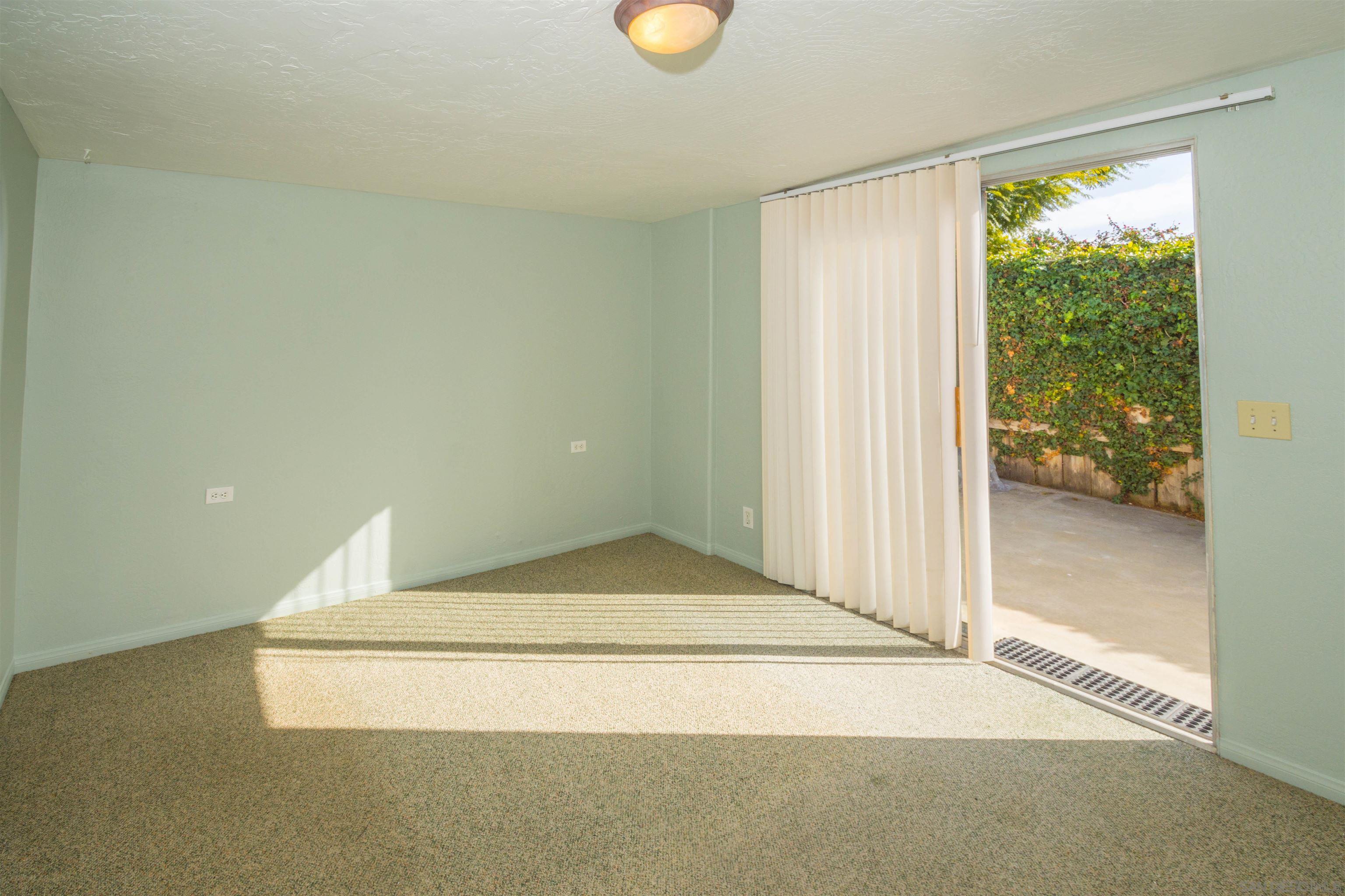 3218 Eureka Place, Unit B Carlsbad, CA 92008 - Photo 7 of 18 a view of empty room with wooden floor and fan