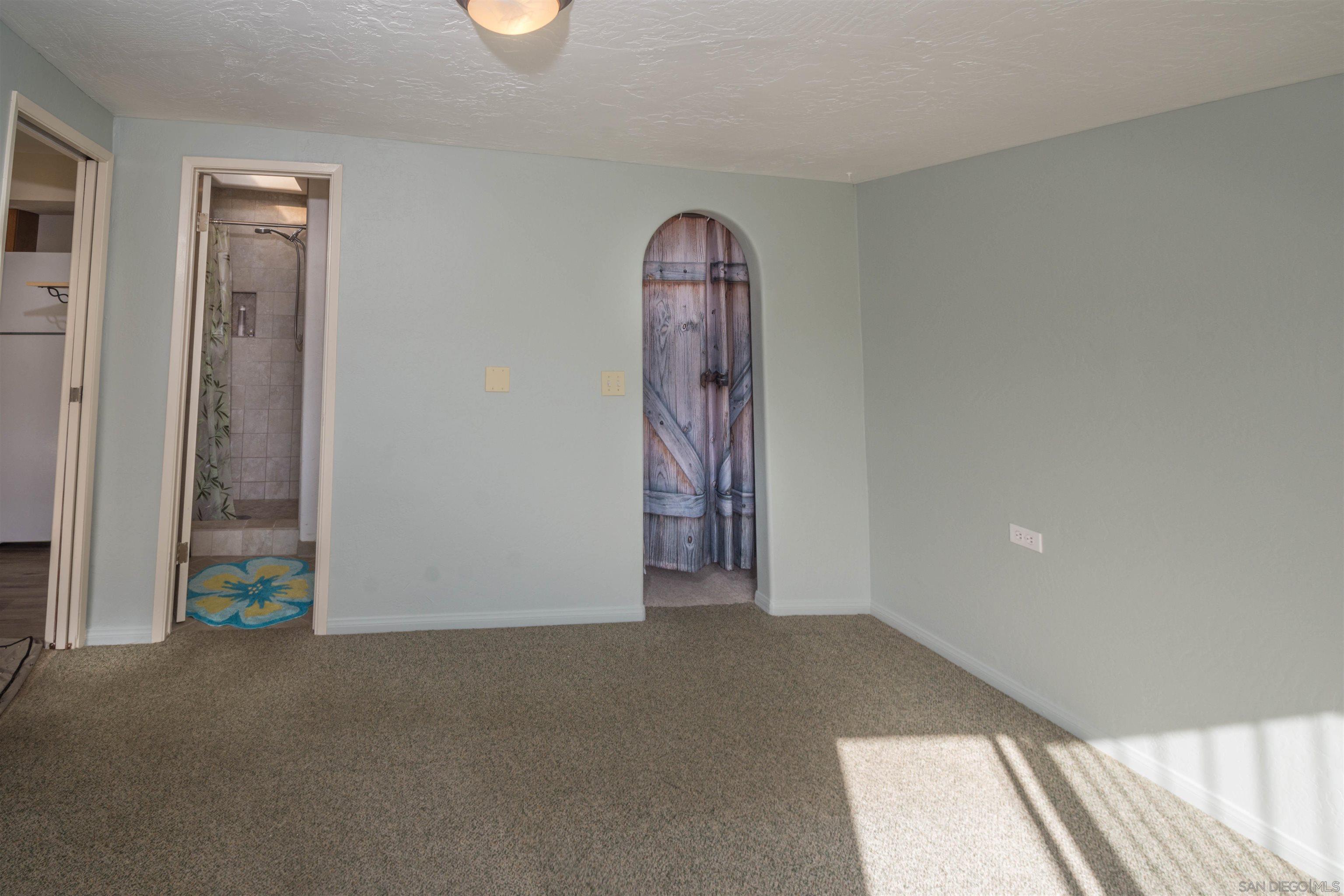 3218 Eureka Place, Unit B Carlsbad, CA 92008 - Photo 8 of 18 a view of empty room with front door
