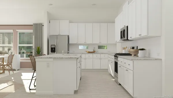 a kitchen with granite countertop white cabinets and white appliances
