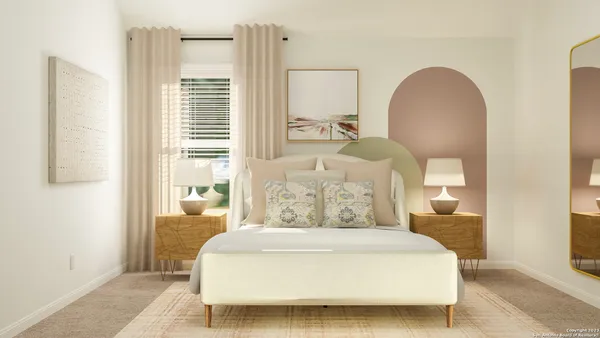 a bedroom with a bed a mirror and a window