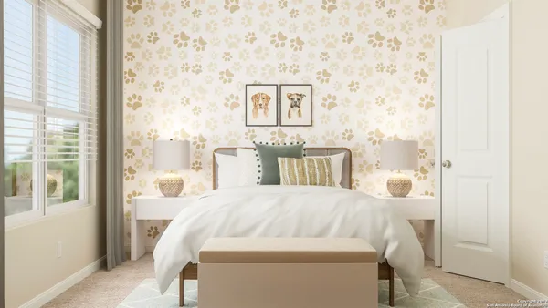 a bed sitting in a bedroom next to a window