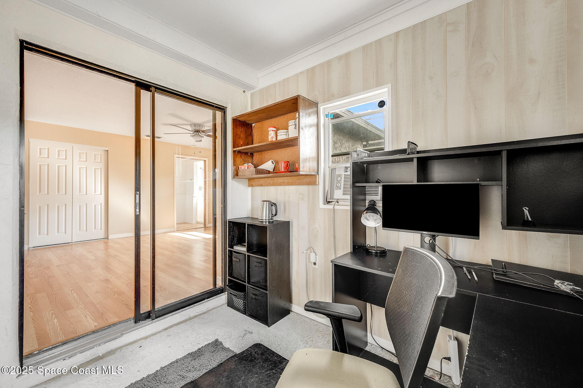 115 Angelo Road Southeast Palm Bay, FL 32909 - Photo 14 of 38 a view of a livingroom with furniture and a flat screen tv