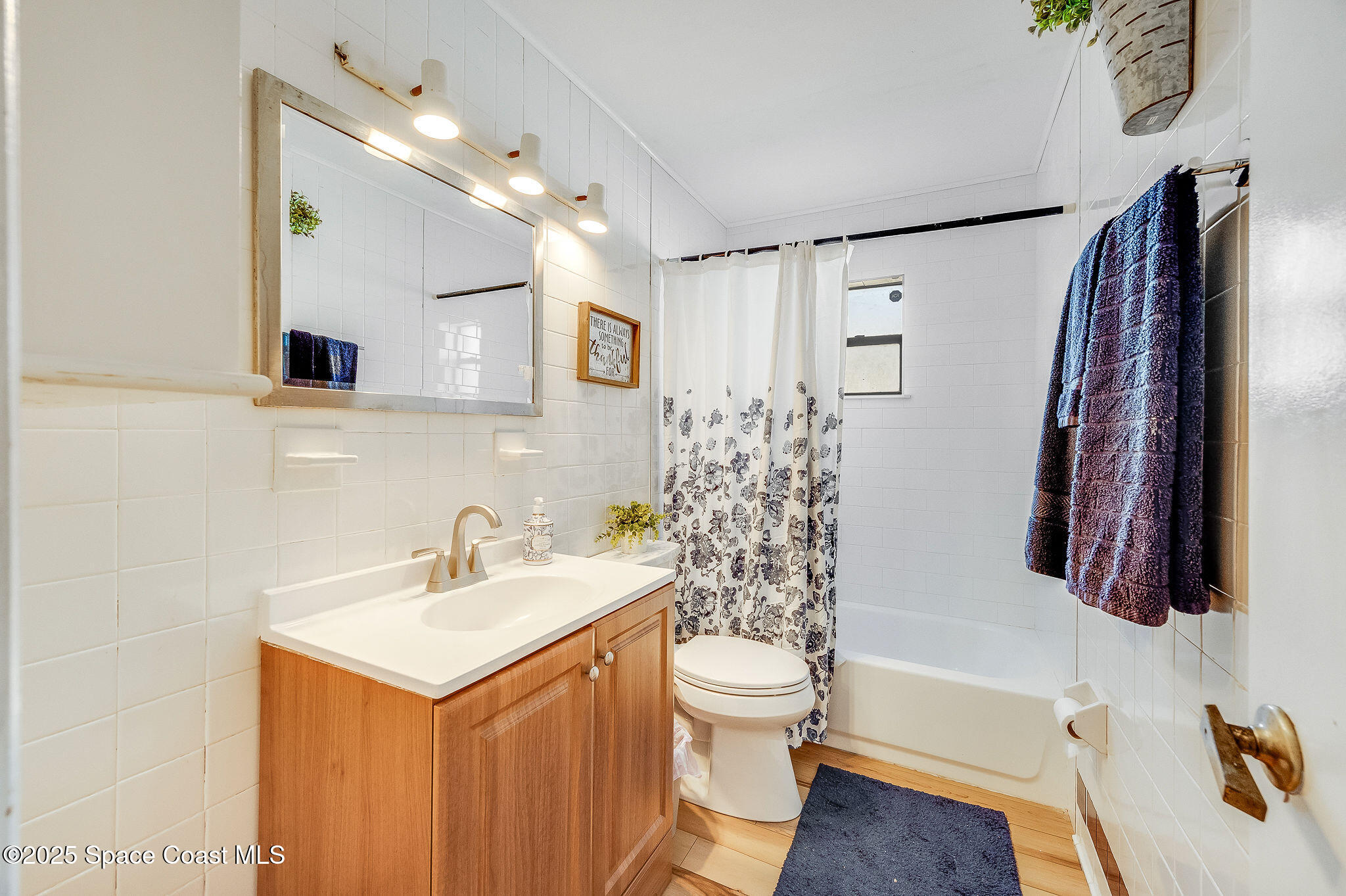 115 Angelo Road Southeast Palm Bay, FL 32909 - Photo 25 of 38 a bathroom with a sink toilet and shower