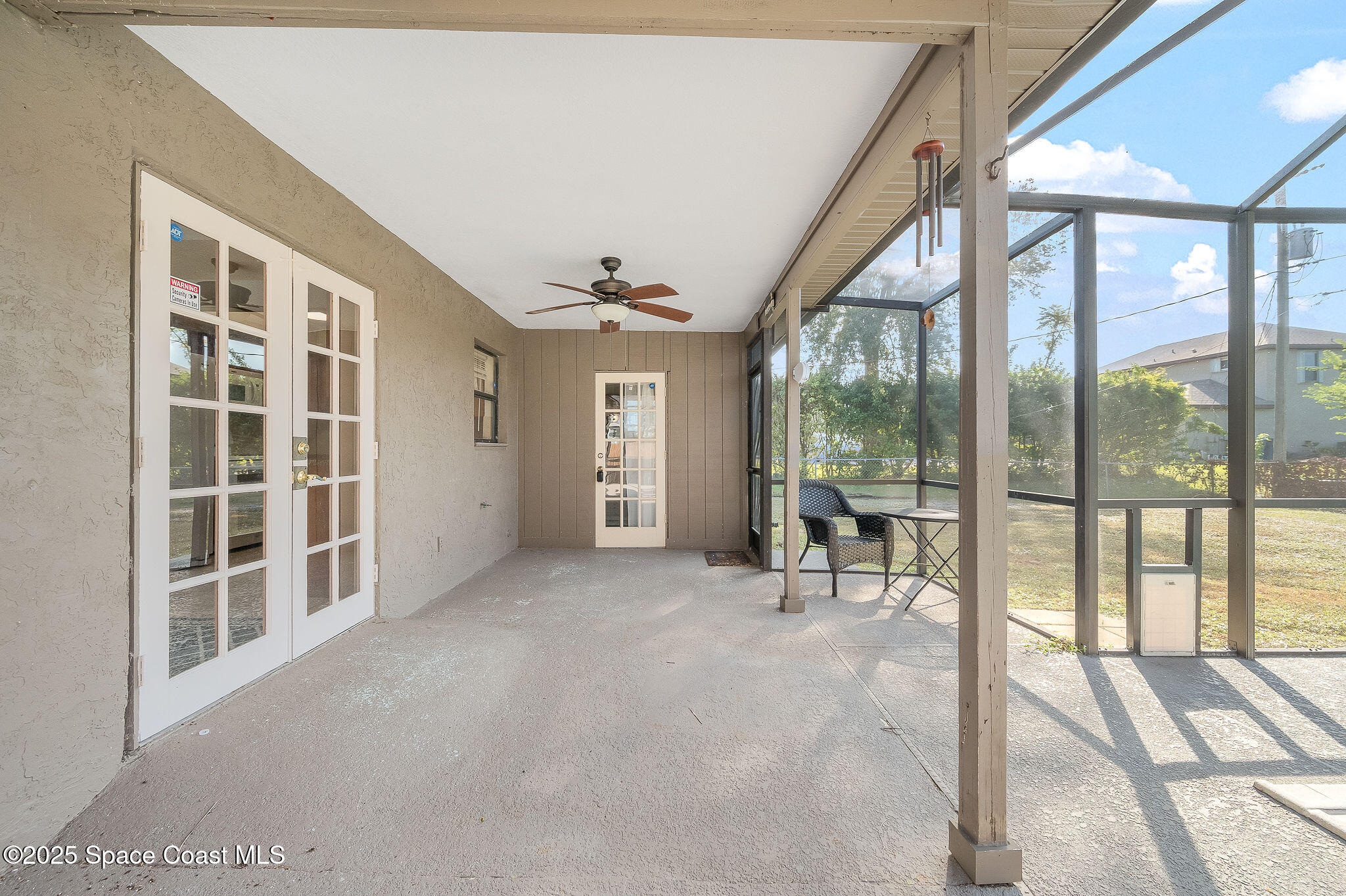 115 Angelo Road Southeast Palm Bay, FL 32909 - Photo 31 of 38 a view of livingroom with furniture and floor to ceiling window