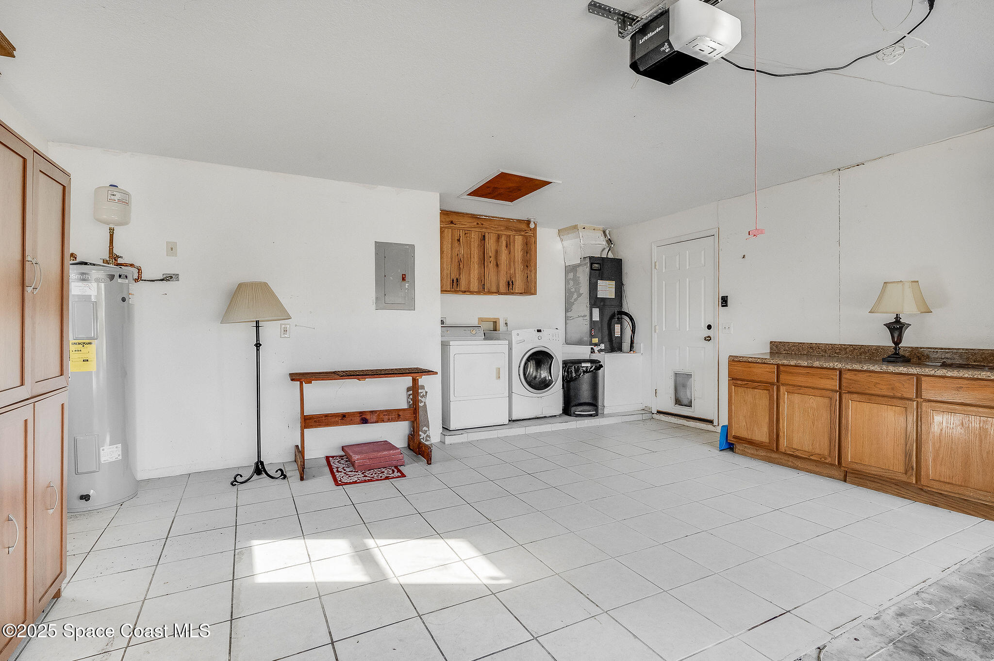 115 Angelo Road Southeast Palm Bay, FL 32909 - Photo 38 of 38 a bedroom with furniture and a chandelier