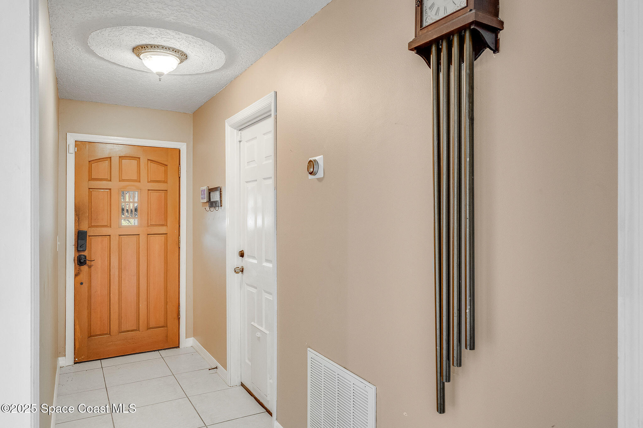 115 Angelo Road Southeast Palm Bay, FL 32909 - Photo 4 of 38 a view of a room with door