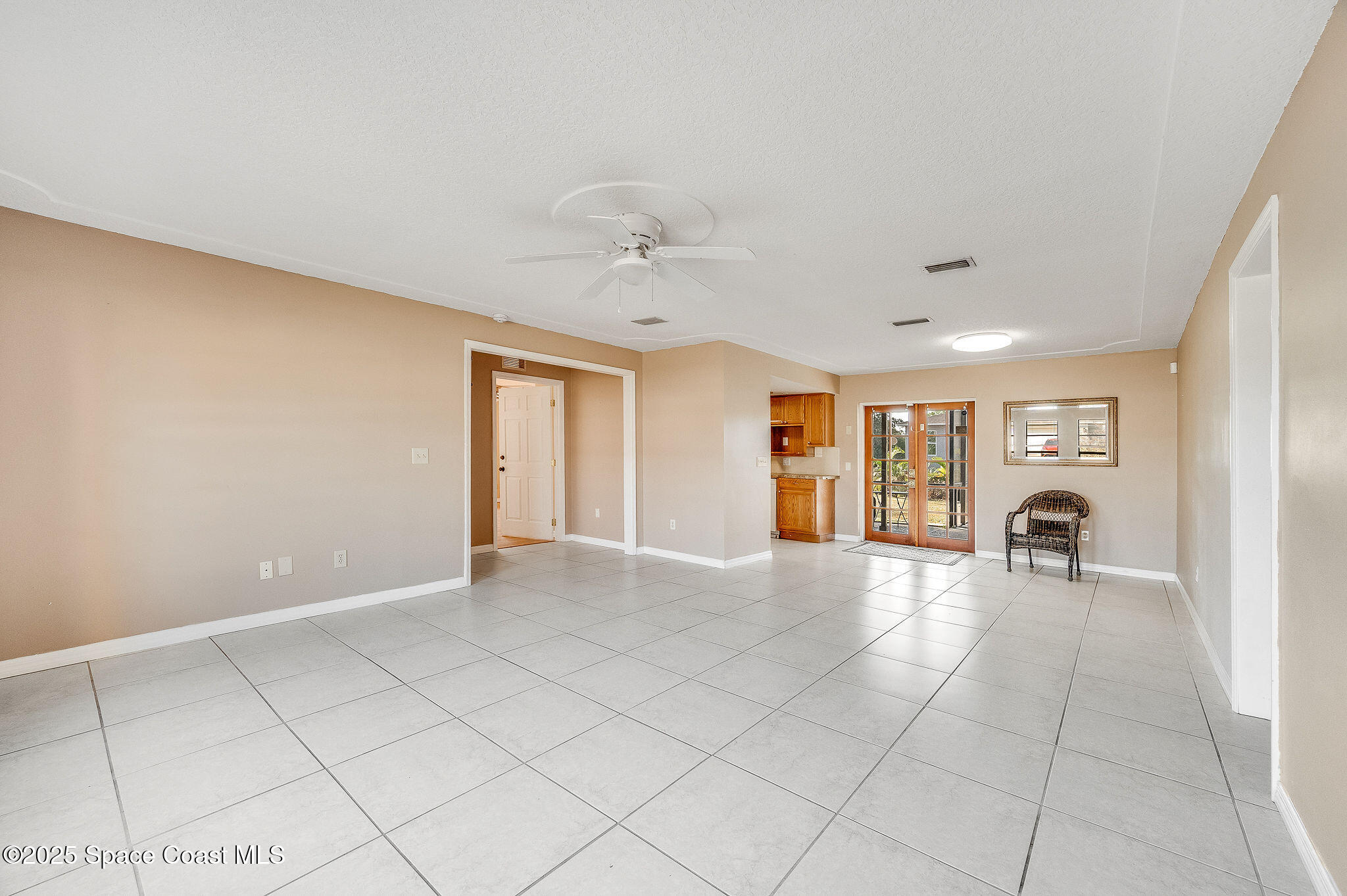 115 Angelo Road Southeast Palm Bay, FL 32909 - Photo 6 of 38 a view of an empty room with a window