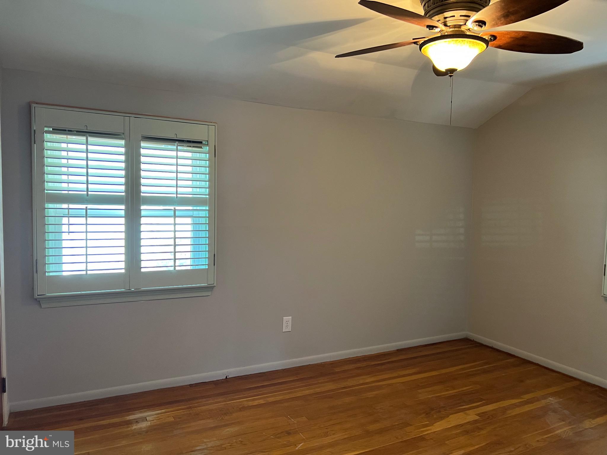 5808 Nystrom Street Hyattsville, MD 20784 - Photo 14 of 38 wooden floor in an empty room with a window