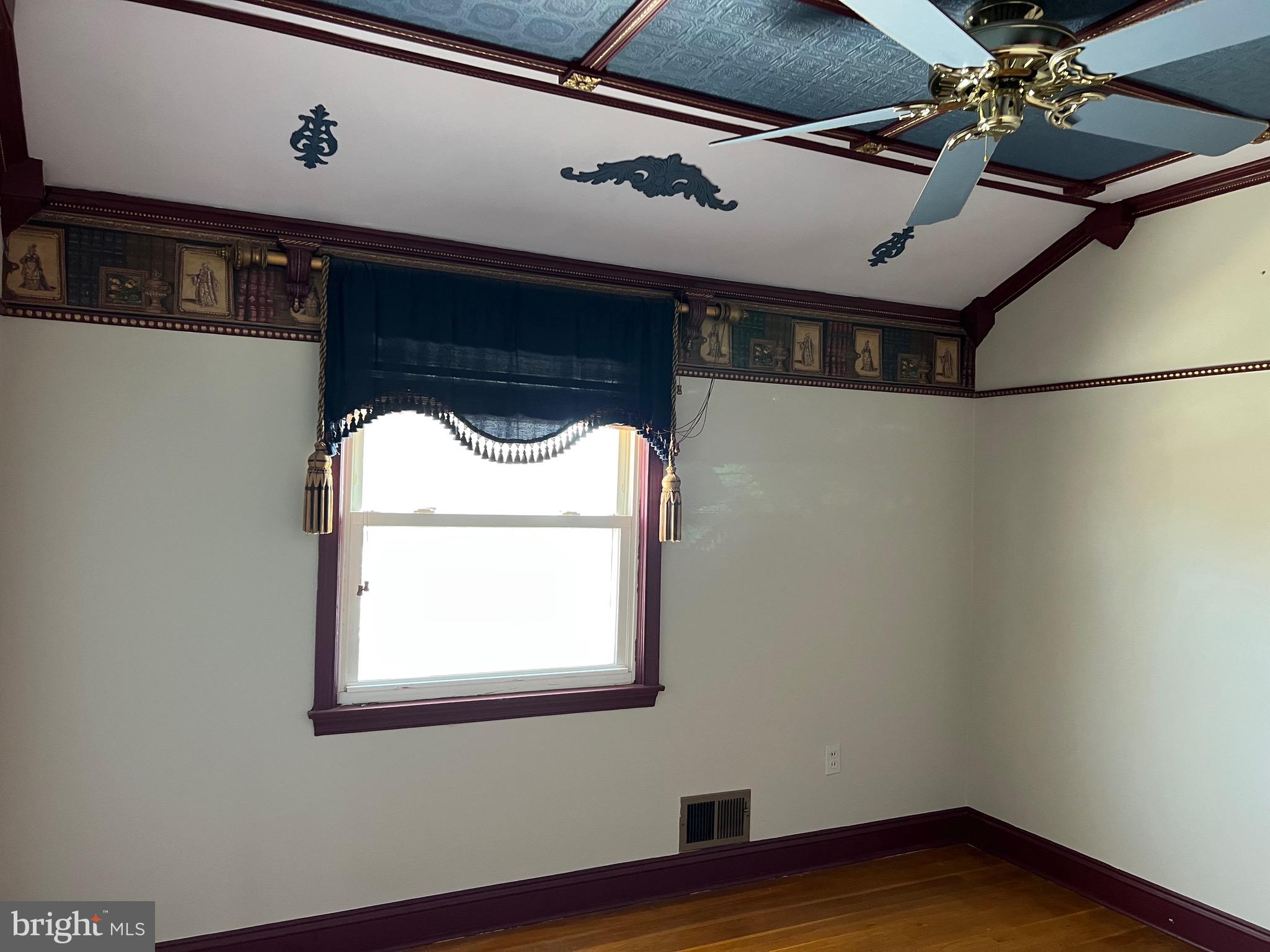 5808 Nystrom Street Hyattsville, MD 20784 - Photo 18 of 38 a view of empty room with wooden floor and fan
