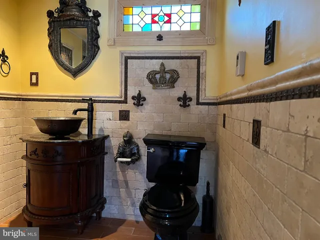 a front view of a fireplace with wooden door