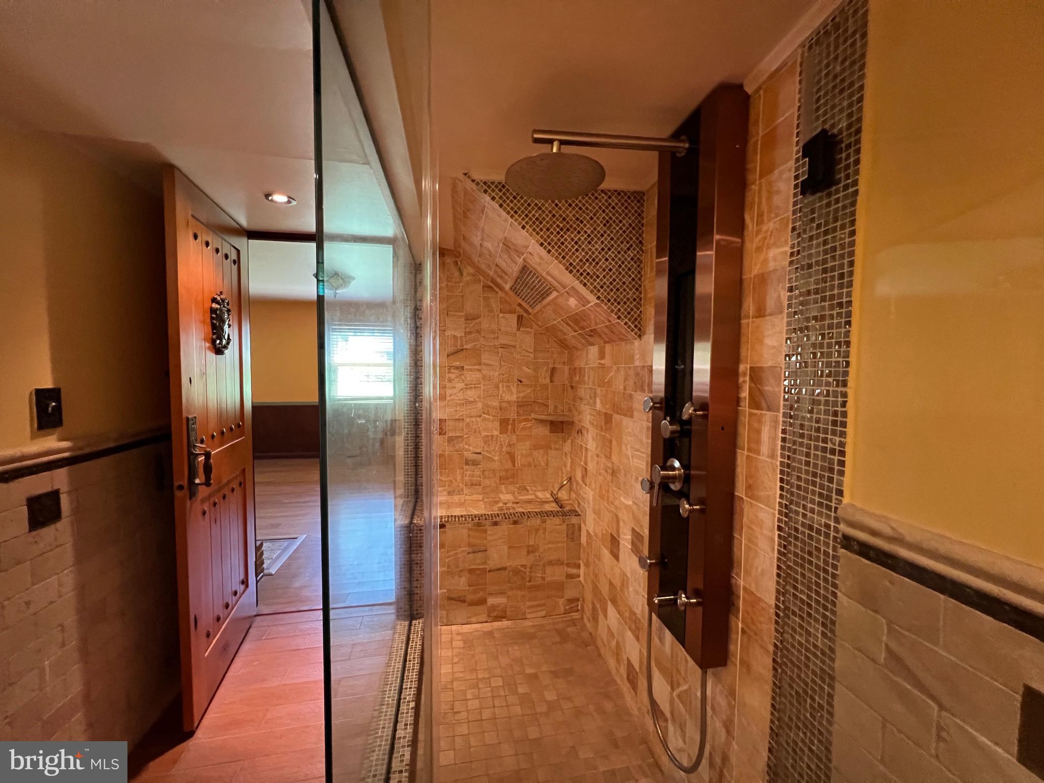 5808 Nystrom Street Hyattsville, MD 20784 - Photo 25 of 38 a bathroom with a shower and a glass door