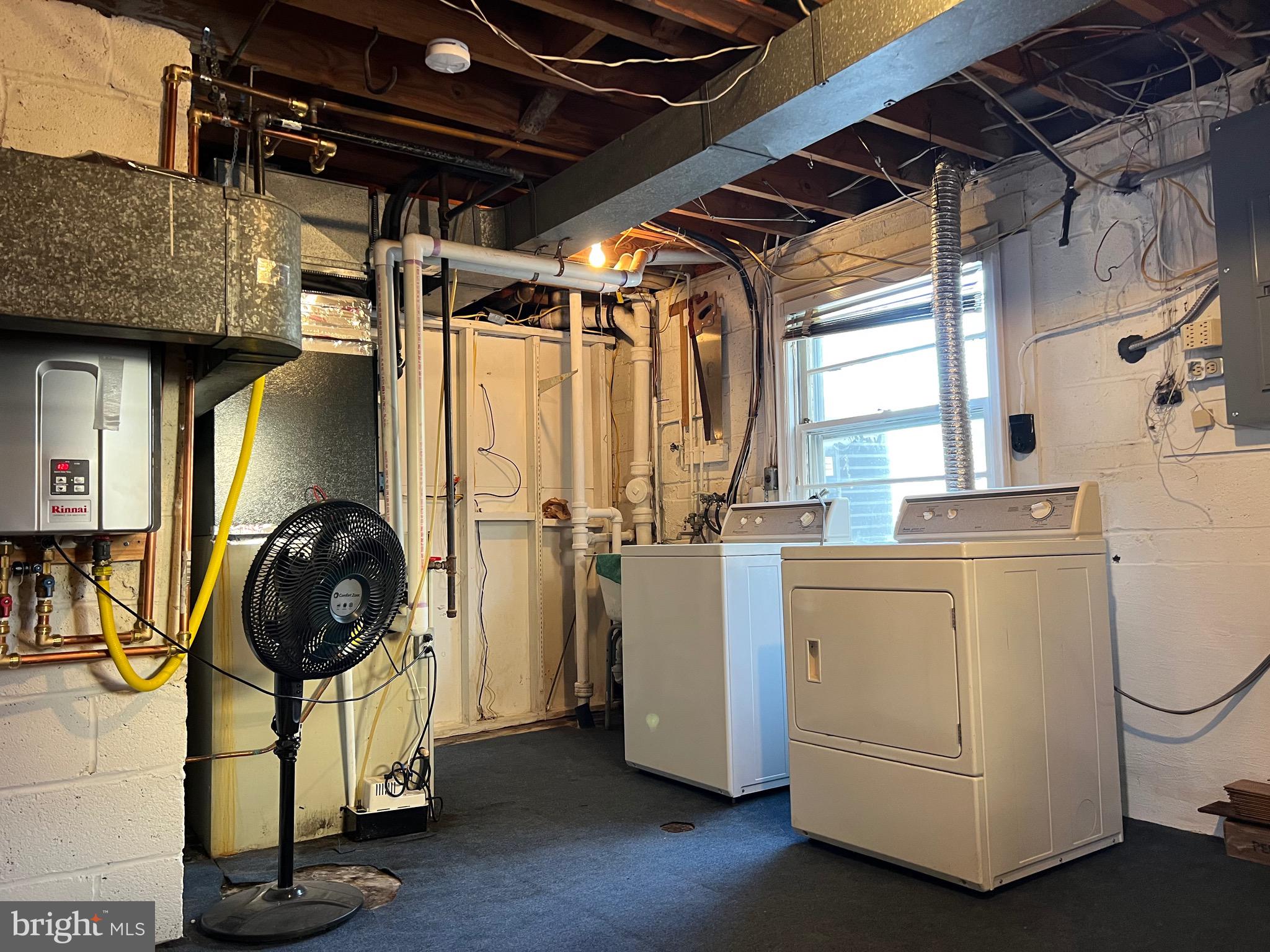 5808 Nystrom Street Hyattsville, MD 20784 - Photo 27 of 38 a view of a storage and utility room with washer and dryer