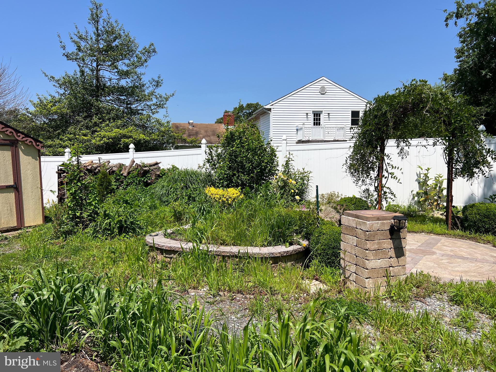 5808 Nystrom Street Hyattsville, MD 20784 - Photo 32 of 38 a front view of a house with a yard and a fountain