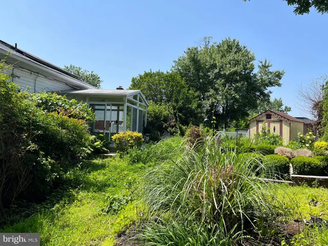 a view of a garden in front of a house