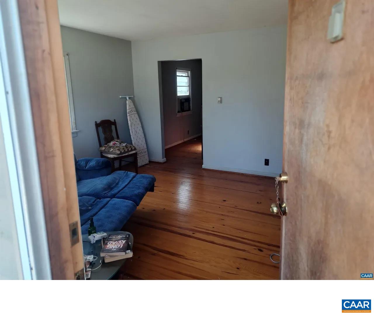 4571 Elly Road Oakpark, VA 22730 - Photo 3 of 10 a black and white room with wooden floor