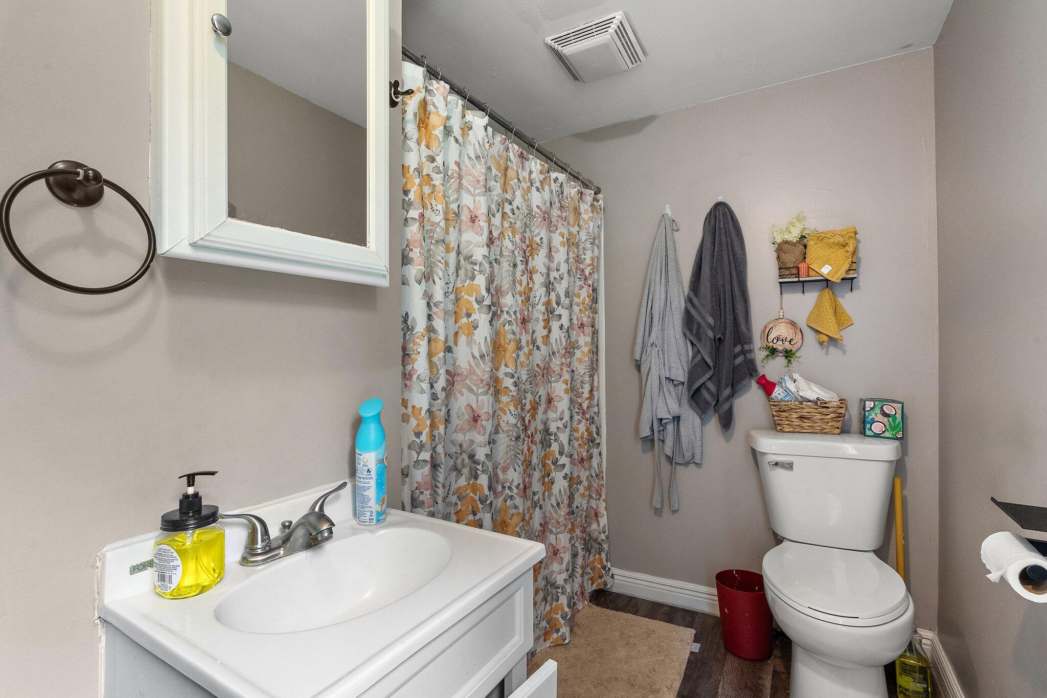 1532 2nd Street La Porte, IN 46350 - Photo 12 of 31 a bathroom with a sink toilet and mirror