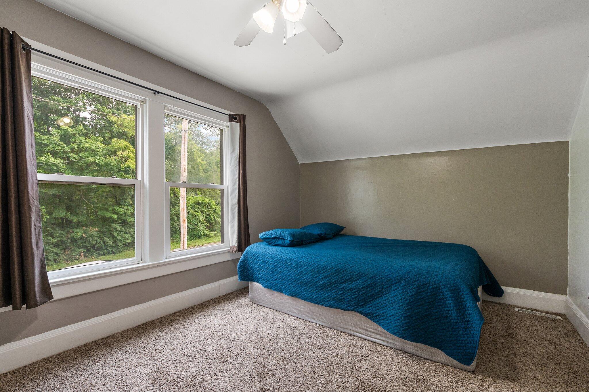 1532 2nd Street La Porte, IN 46350 - Photo 18 of 31 a bed sitting in a bedroom next to a window