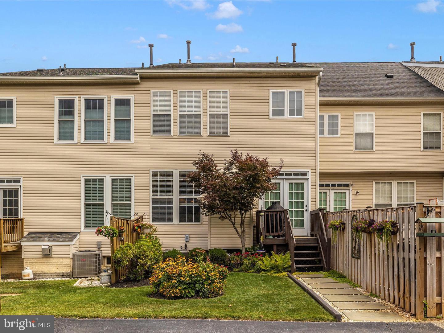 1731 Derrs Square West Frederick, MD 21701 - Photo 17 of 23 a front view of a house with a yard