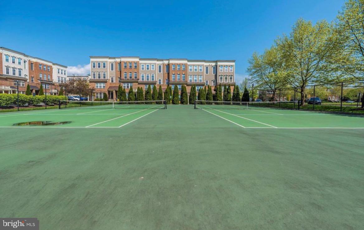 1731 Derrs Square West Frederick, MD 21701 - Photo 23 of 23 a view of a stadium that has a big yard with plants and large trees