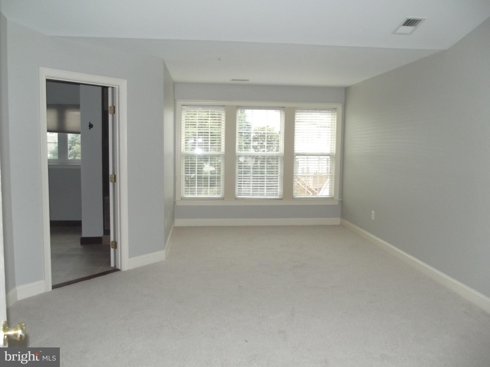 1731 Derrs Square West Frederick, MD 21701 - Photo 9 of 23 a view of an empty room with a window