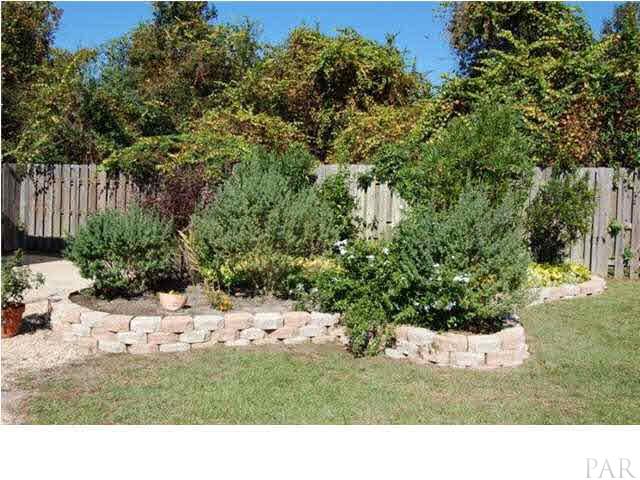 6040 Otter Point Road Pensacola, FL 32504 - Photo 19 of 23 Meticulous landscaping is sure to please