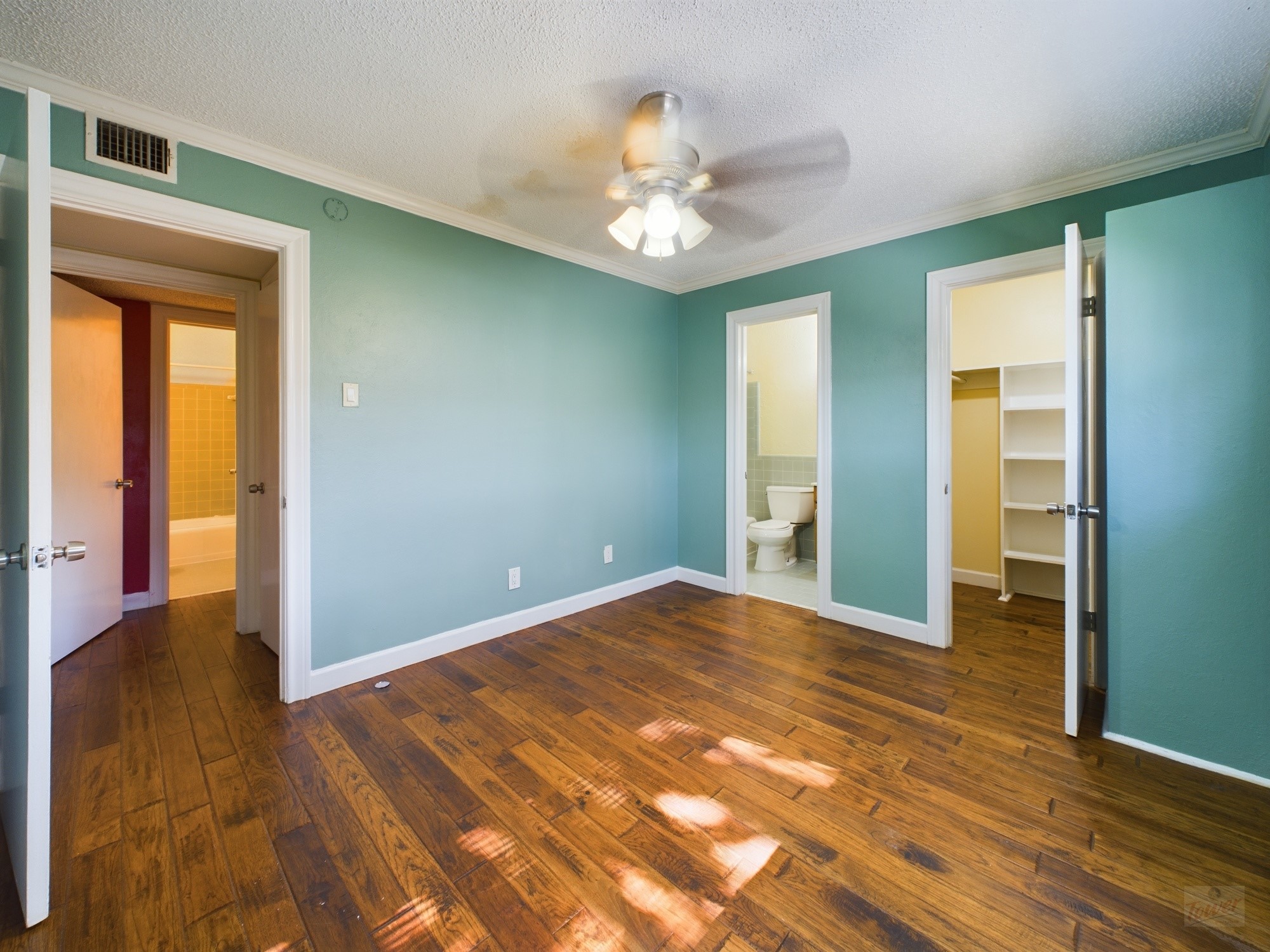 803 West 28th Street, Unit 206 Austin, TX 78705 - Photo 5 of 25 a view of an empty room with wooden floor and a window
