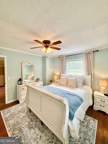 a bed room with a bed and a mirror