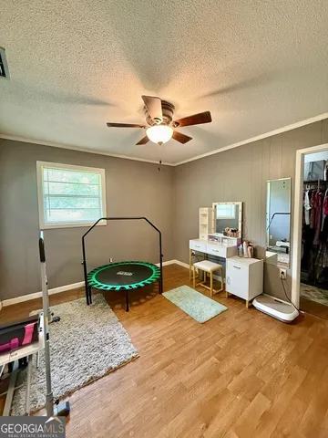 a bedroom with furniture and a chandelier