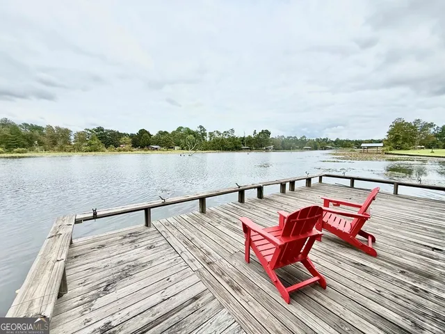 a view of wooden deck with lake view