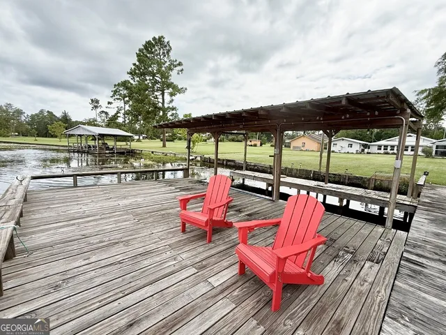 a view of swimming pool with sitting area